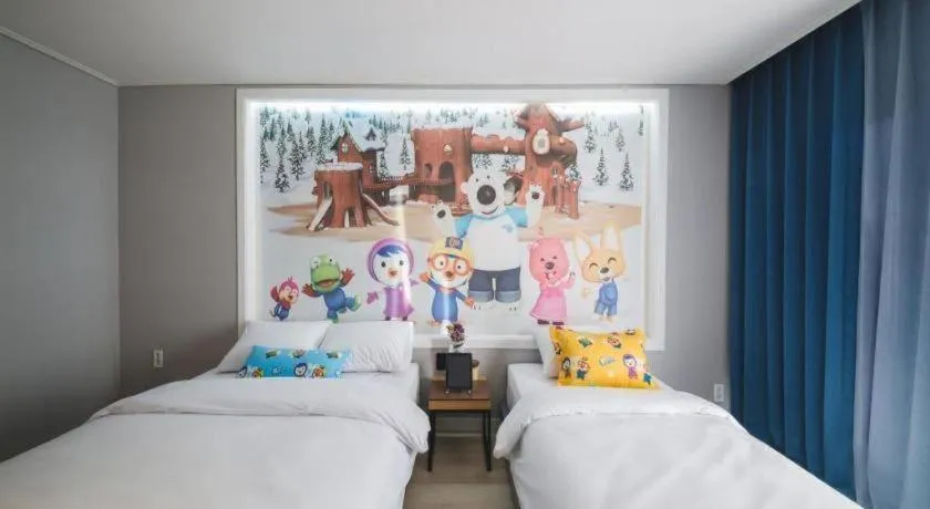 Bed in Sallys Jeju Hotel