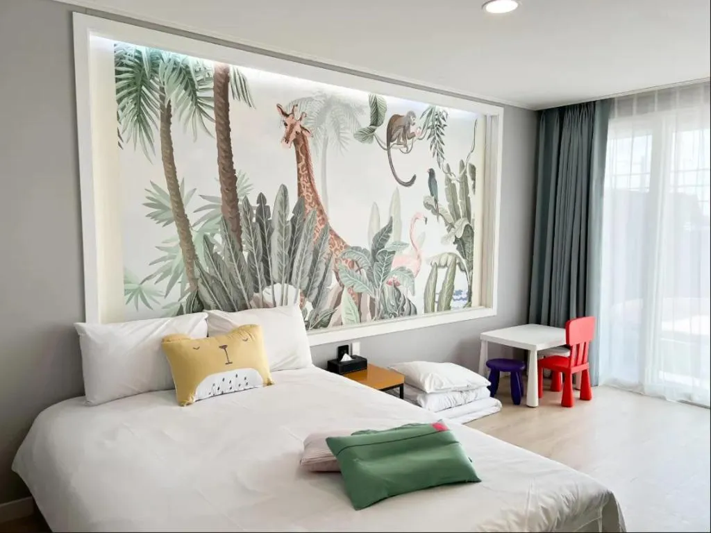 Bed in Sallys Jeju Hotel