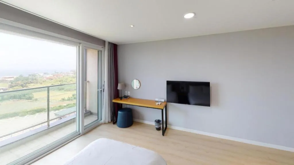 Bed in Sallys Jeju Hotel