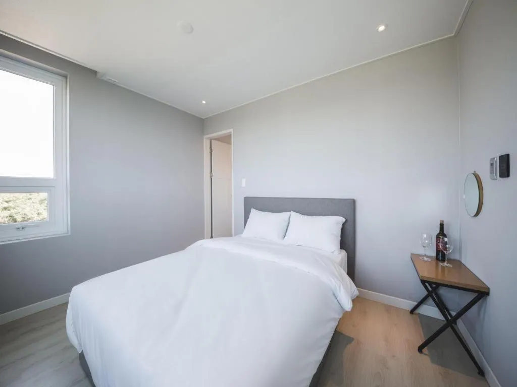 Bed in Sallys Jeju Hotel