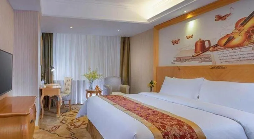 Bed in Vienna Hotel Shenzhen Longgang Dayun Center Branch