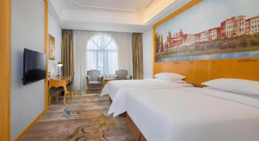 Bed in Vienna Hotel Shenzhen Longgang Dayun Center Branch