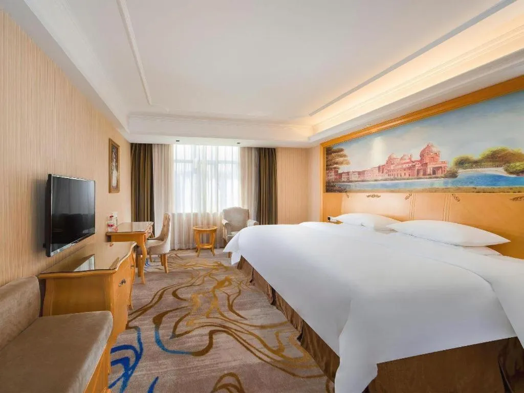 Bed in Vienna Hotel Shenzhen Longgang Dayun Center Branch