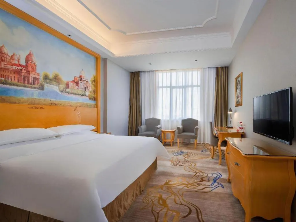 Bed in Vienna Hotel Shenzhen Longgang Dayun Center Branch