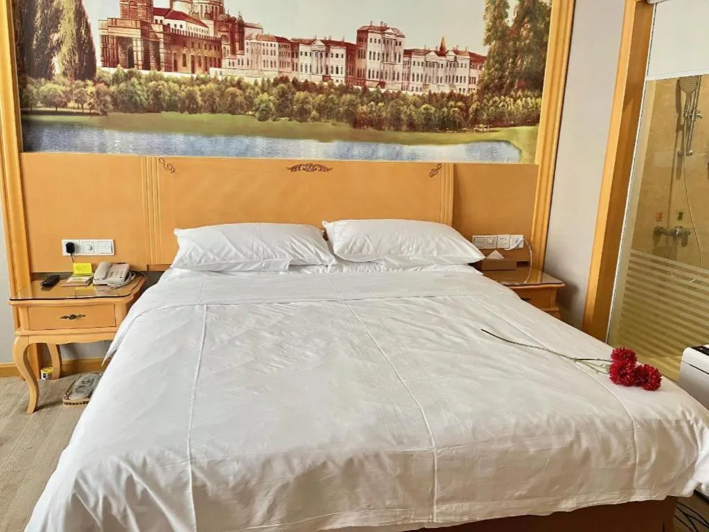 Bed in Vienna Hotel Shenzhen Longgang Dayun Center Branch