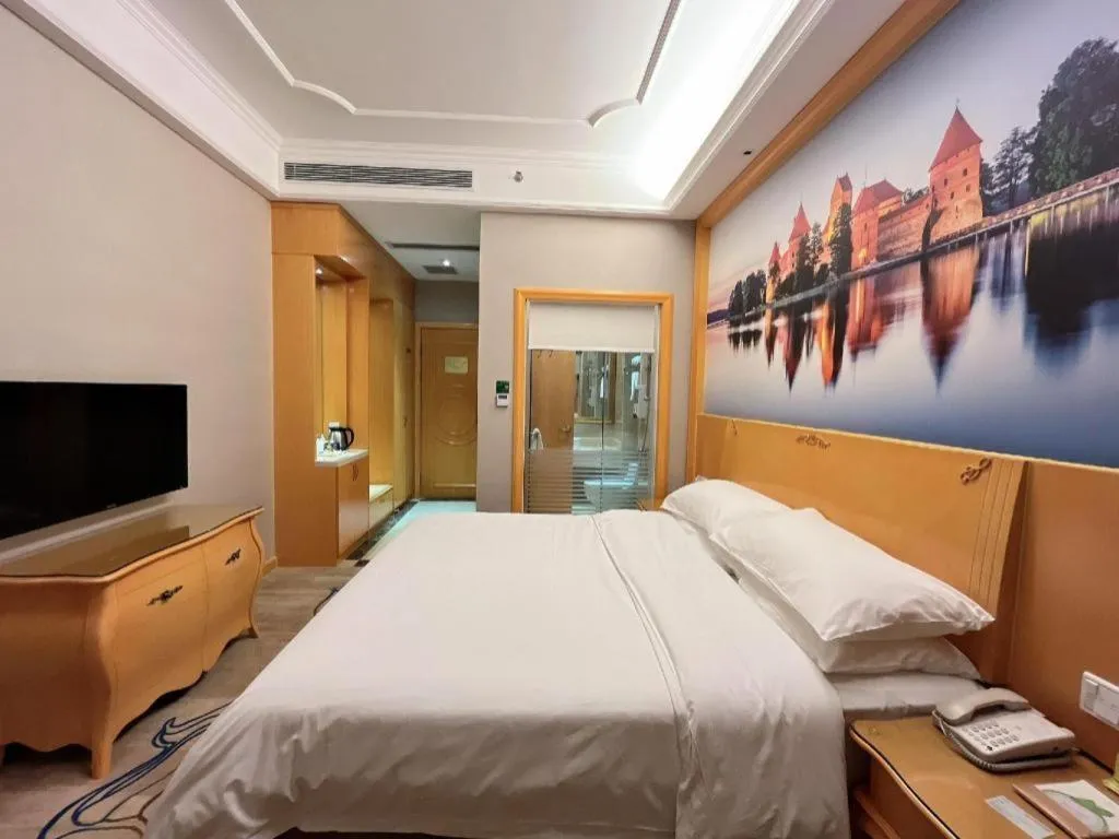 Bed in Vienna Hotel Shenzhen Longgang Dayun Center Branch