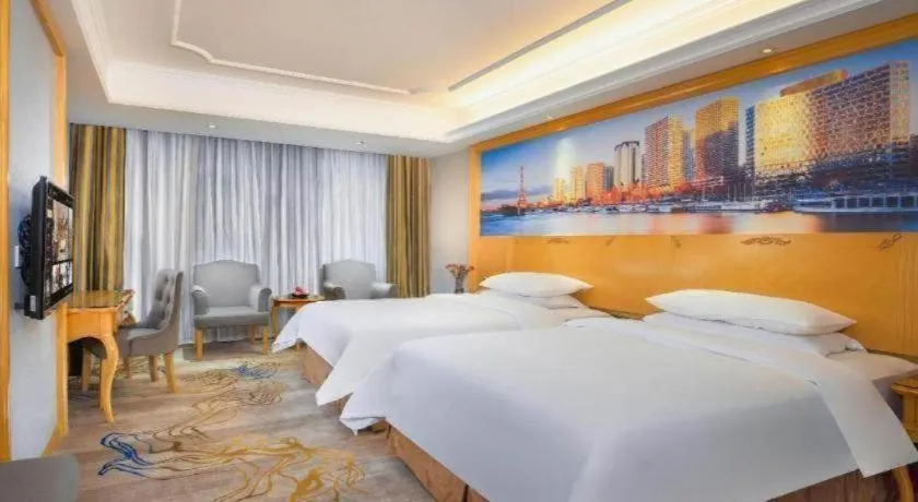 Bed in Vienna Hotel Shenzhen Longgang Dayun Center Branch
