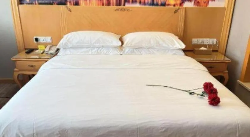 Bed in Vienna Hotel Shenzhen Longgang Dayun Center Branch