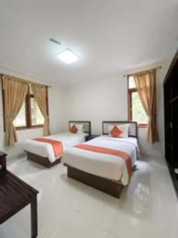 Bed in Ole Suite Hotel and Cottage