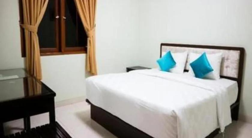 Bed in Ole Suite Hotel and Cottage