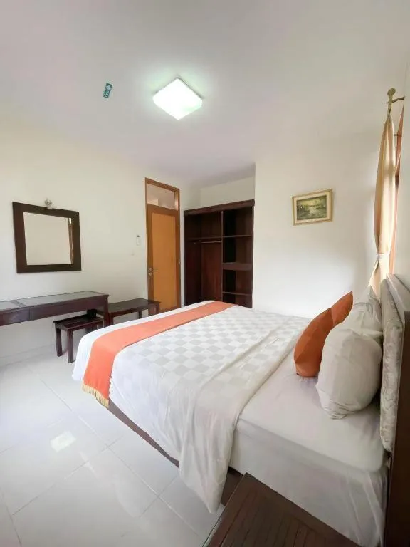 Bed in Ole Suite Hotel and Cottage