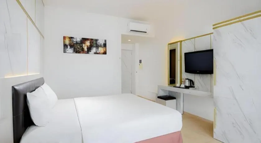 Bed in Grand Malioboro Yogyakarta