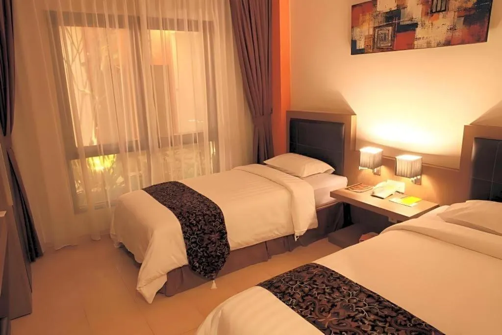 Bed in Grand Malioboro Yogyakarta