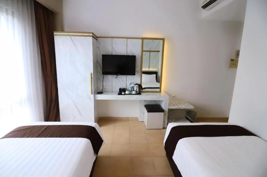 Bed in Grand Malioboro Yogyakarta