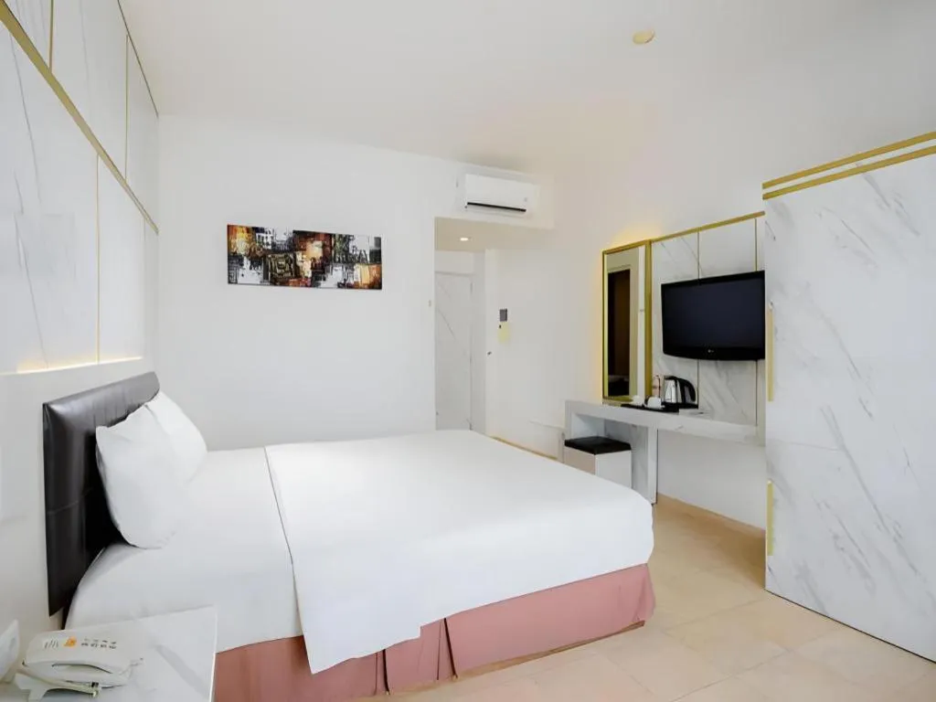 Bed in Grand Malioboro Yogyakarta