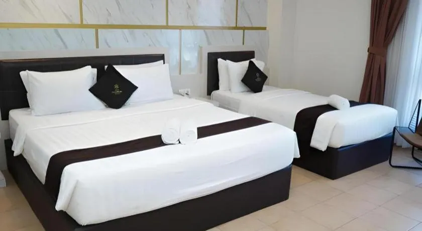 Bed in Grand Malioboro Yogyakarta