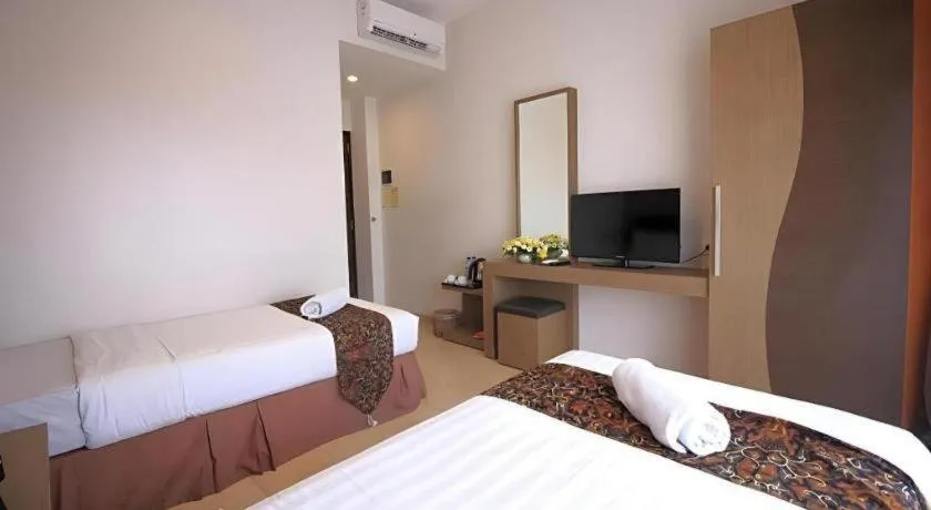 Bed in Grand Malioboro Yogyakarta