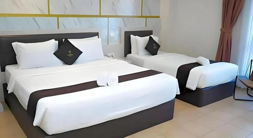 Bed in Grand Malioboro Yogyakarta