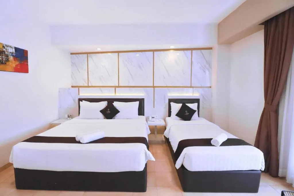 Bed in Grand Malioboro Yogyakarta