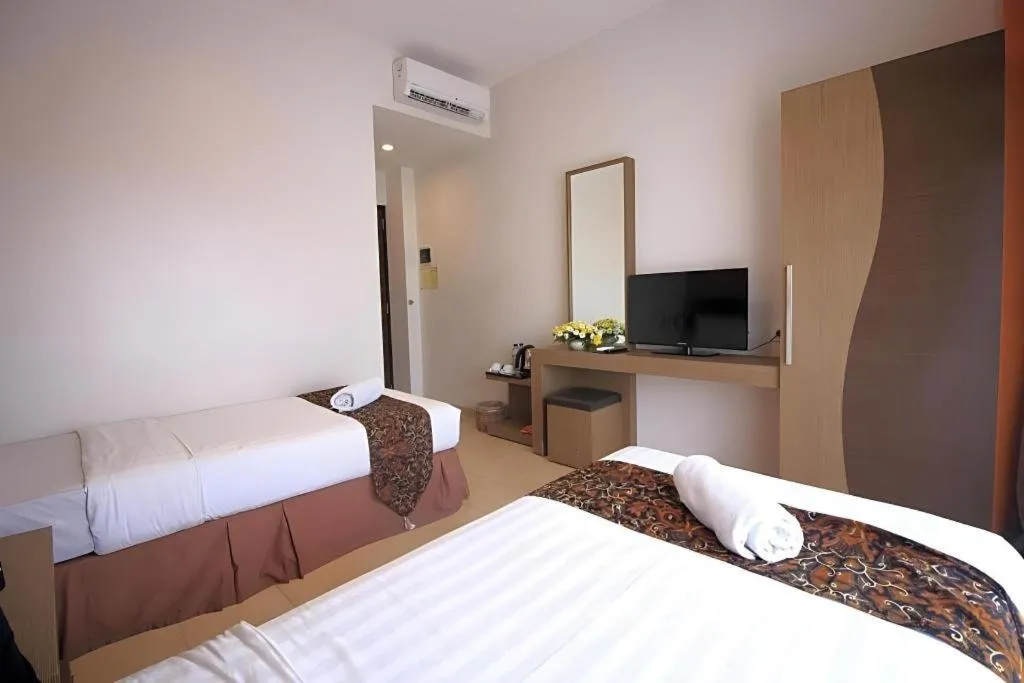 Bed in Grand Malioboro Yogyakarta