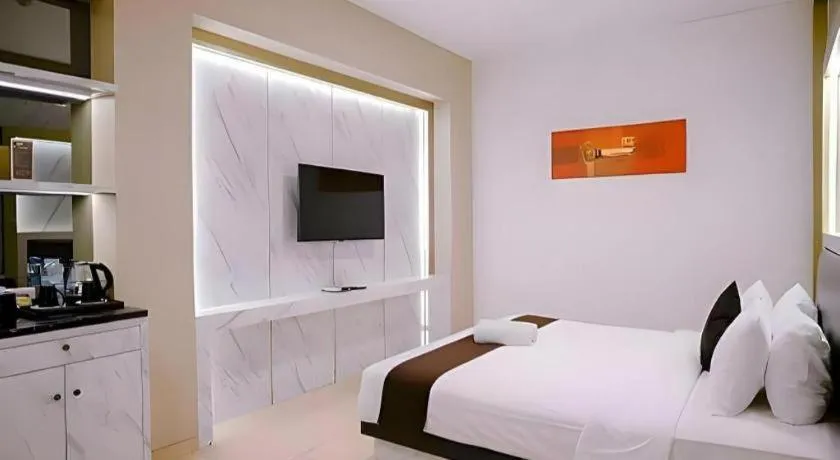 Bed in Grand Malioboro Yogyakarta