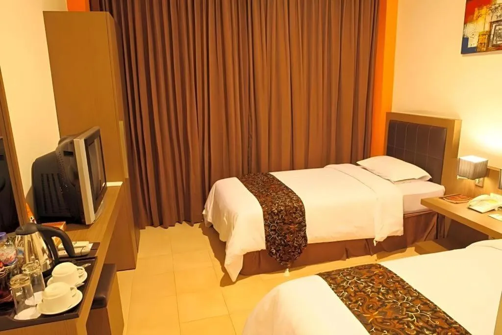 Bed in Grand Malioboro Yogyakarta