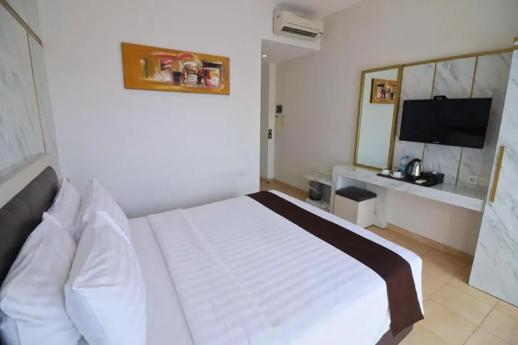 Bed in Grand Malioboro Yogyakarta