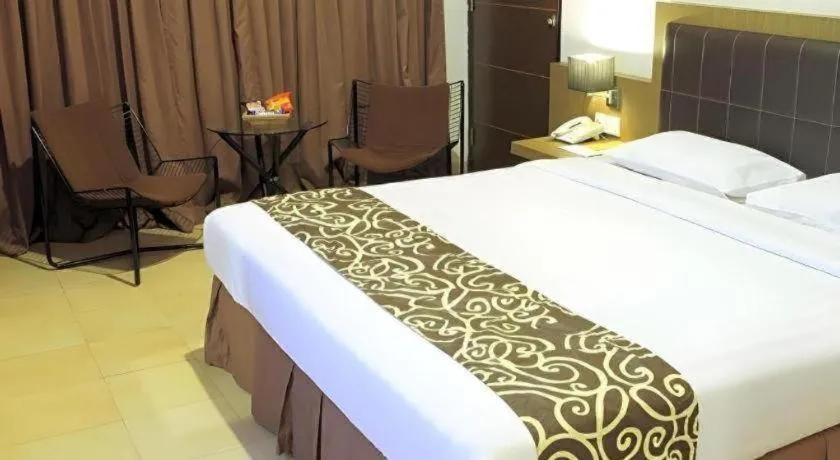 Bed in Grand Malioboro Yogyakarta