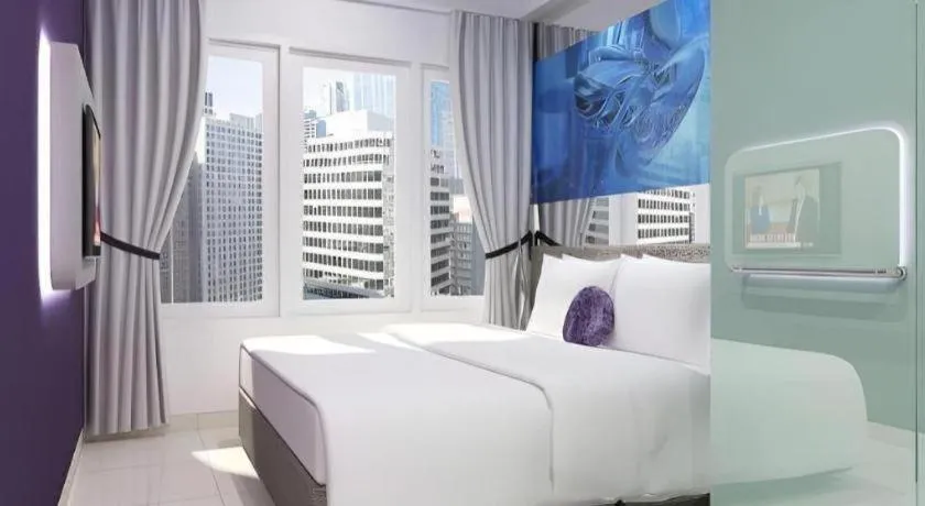 Bed in G Suites Hotel By AMITHYA