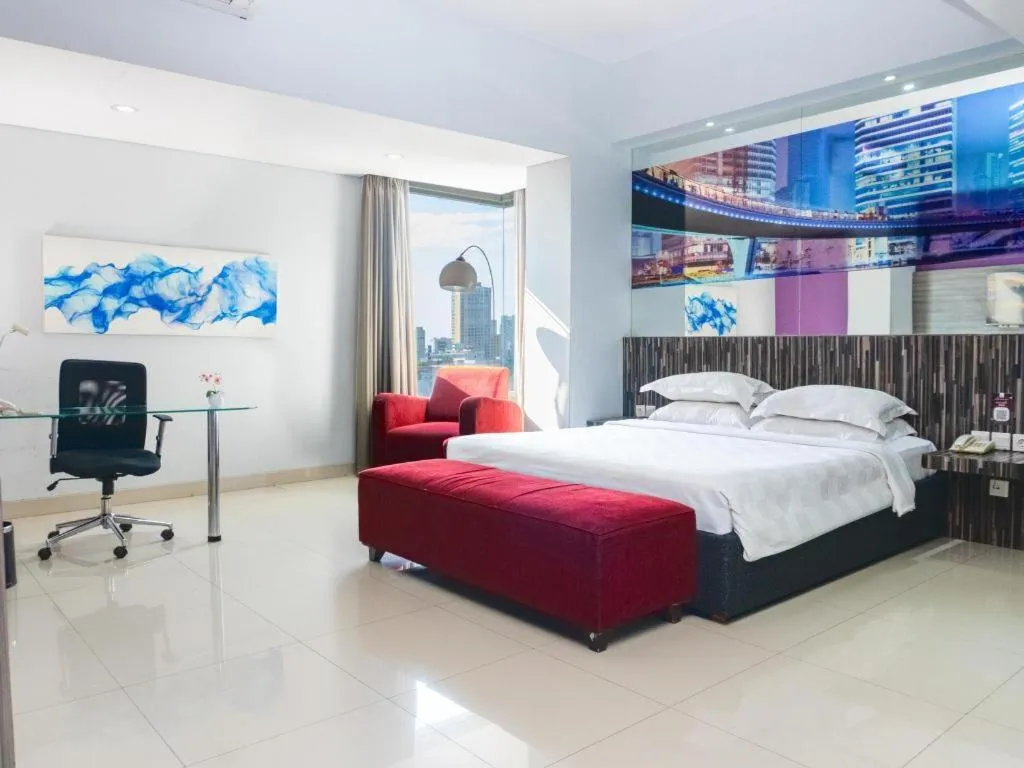 Bed in G Suites Hotel By AMITHYA