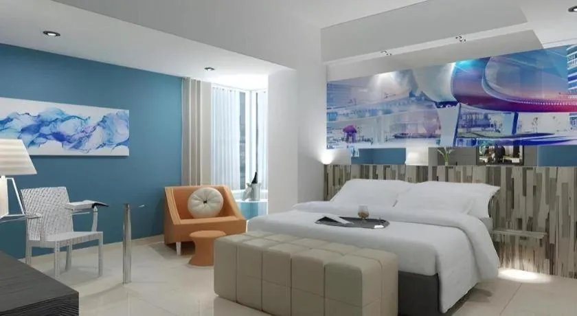 Bed in G Suites Hotel By AMITHYA