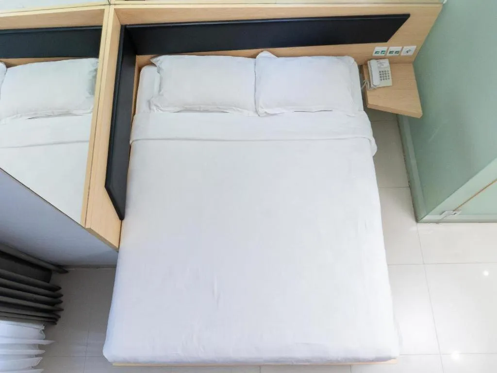 Bed in G Suites Hotel By AMITHYA