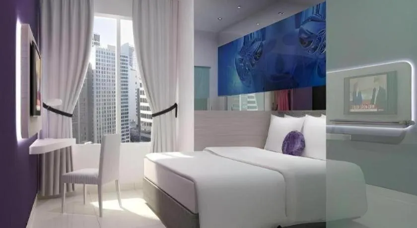 Bed in G Suites Hotel By AMITHYA