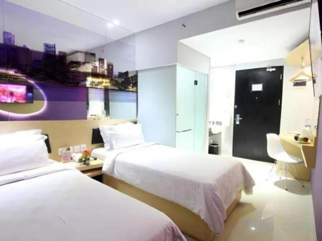 Bed in G Suites Hotel By AMITHYA