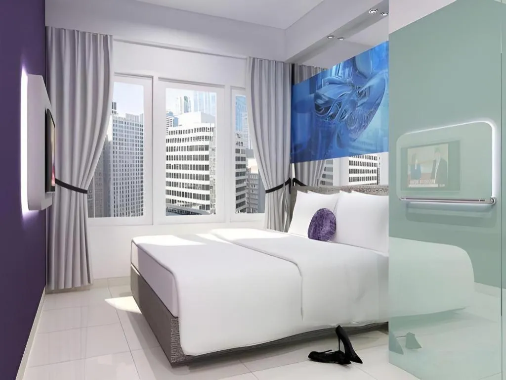 Bed in G Suites Hotel By AMITHYA