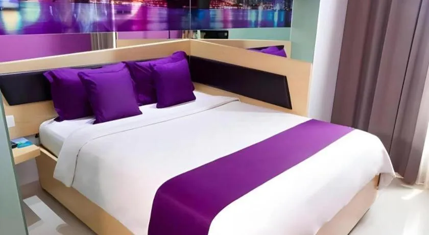Bed in G Suites Hotel By AMITHYA