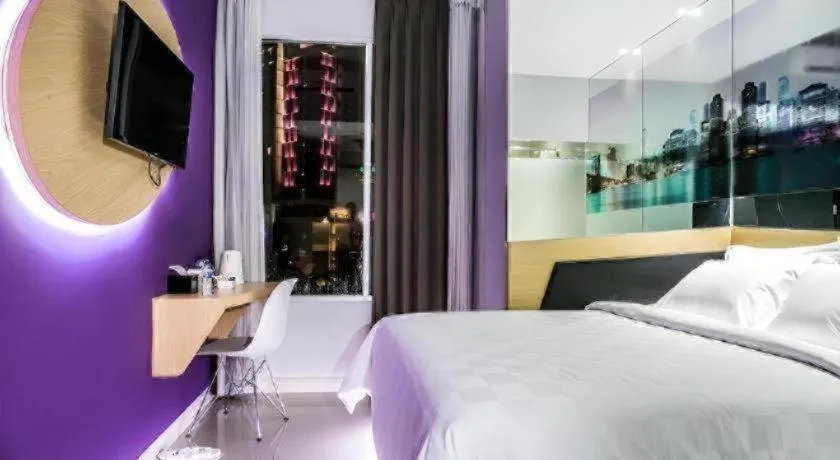 Bed in G Suites Hotel By AMITHYA