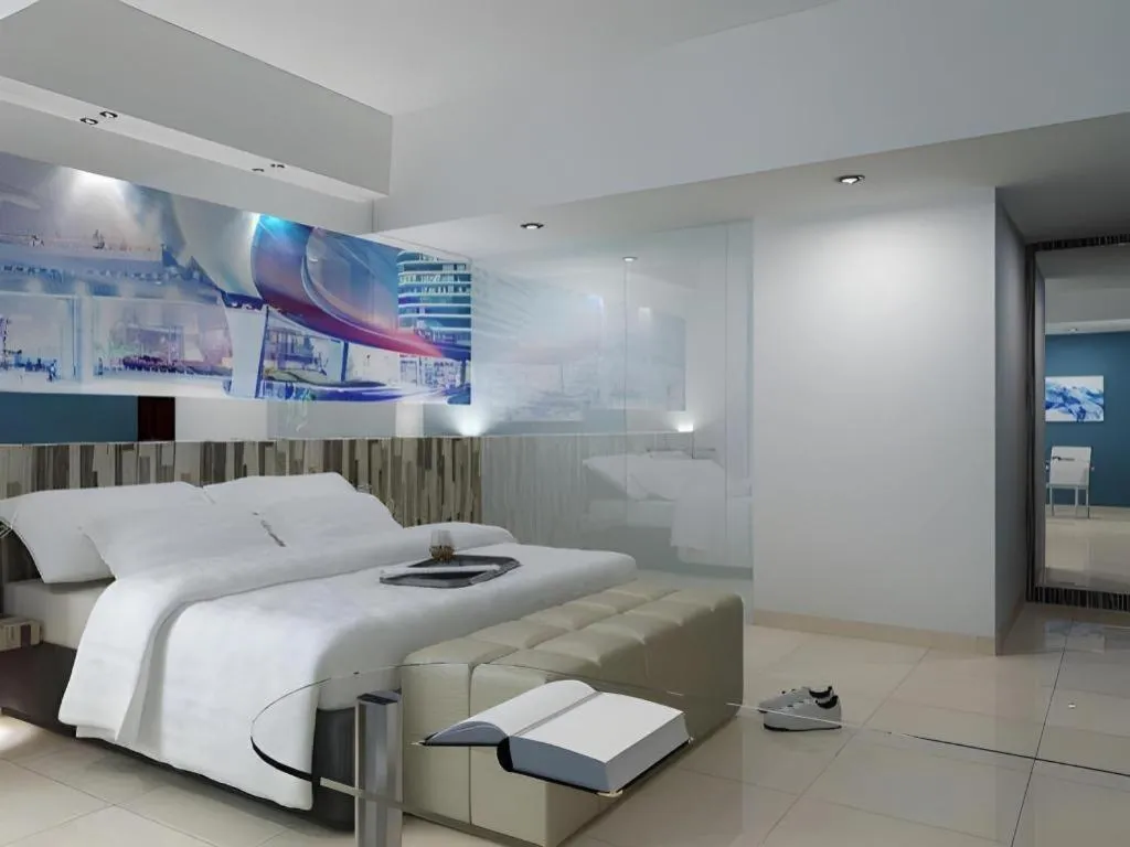 Bed in G Suites Hotel By AMITHYA