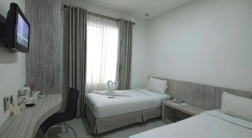 Bed in HW Hotel Padang