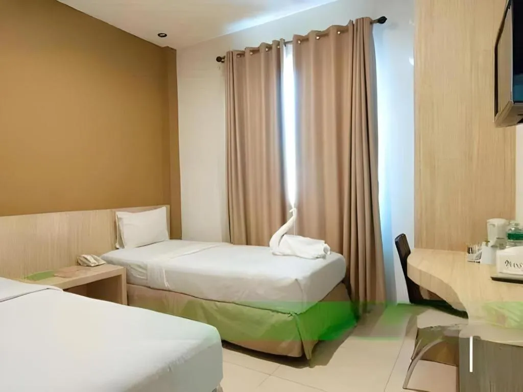 Bed in HW Hotel Padang