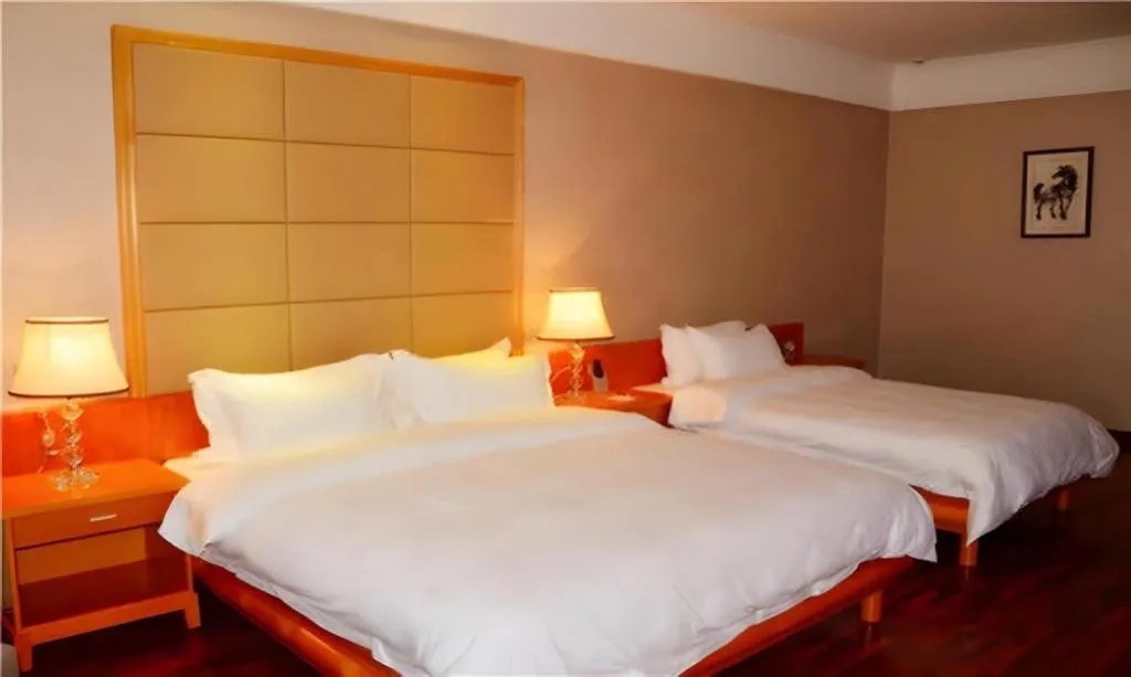 Bed in San Jiang Grand Hotel