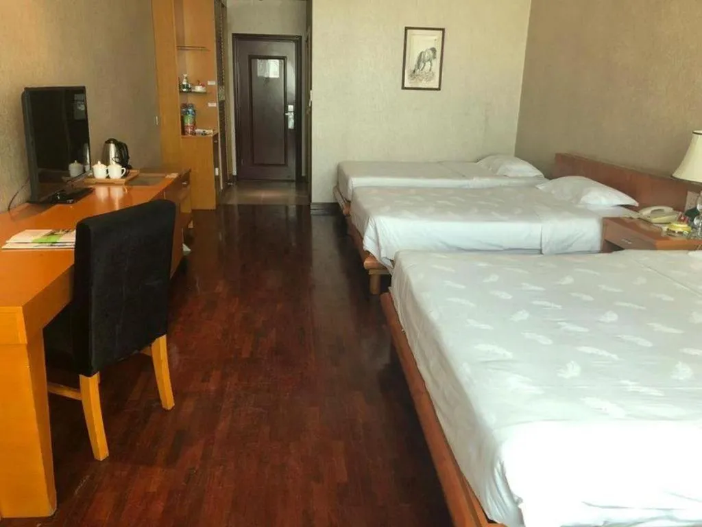 Bed in San Jiang Grand Hotel