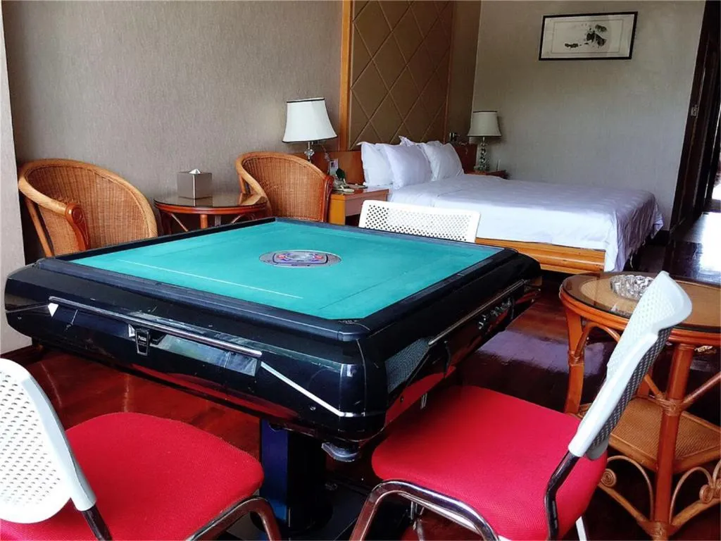 Bed in San Jiang Grand Hotel