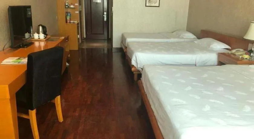 Bed in San Jiang Grand Hotel