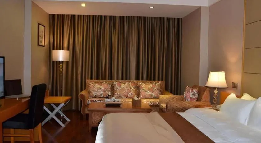 Bed in San Jiang Grand Hotel