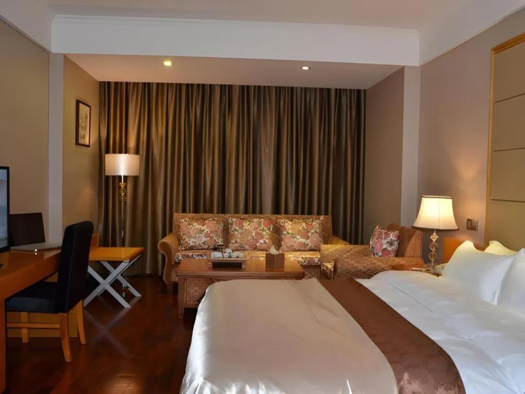 Bed in San Jiang Grand Hotel