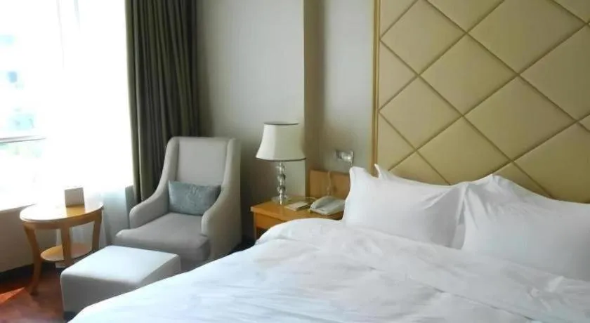 Bed in San Jiang Grand Hotel