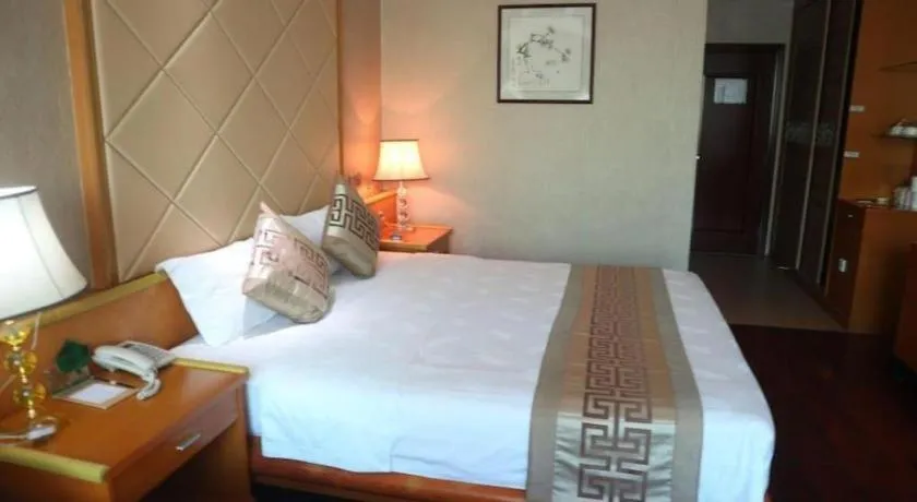 Bed in San Jiang Grand Hotel