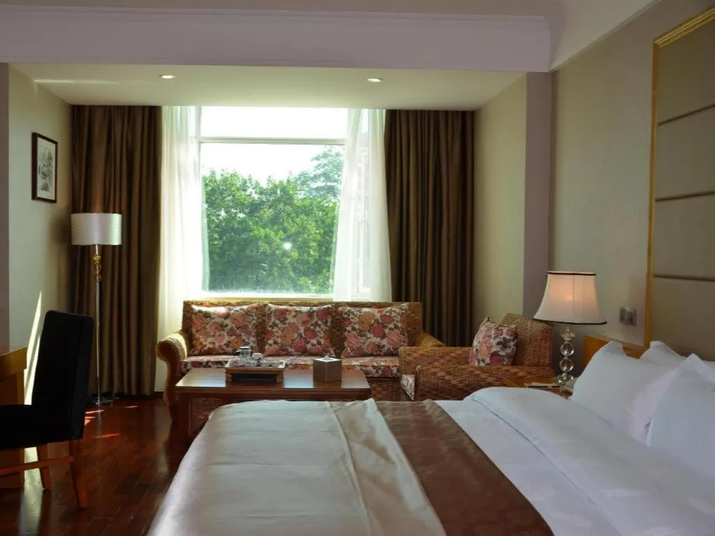 Bed in San Jiang Grand Hotel