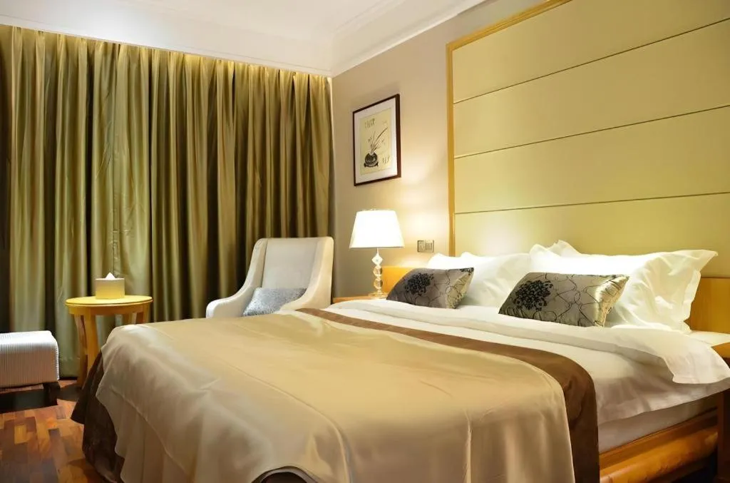 Bed in San Jiang Grand Hotel